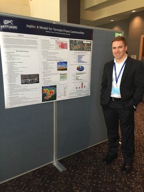 Matthew Dross in front of his poster at the NWA Conference.